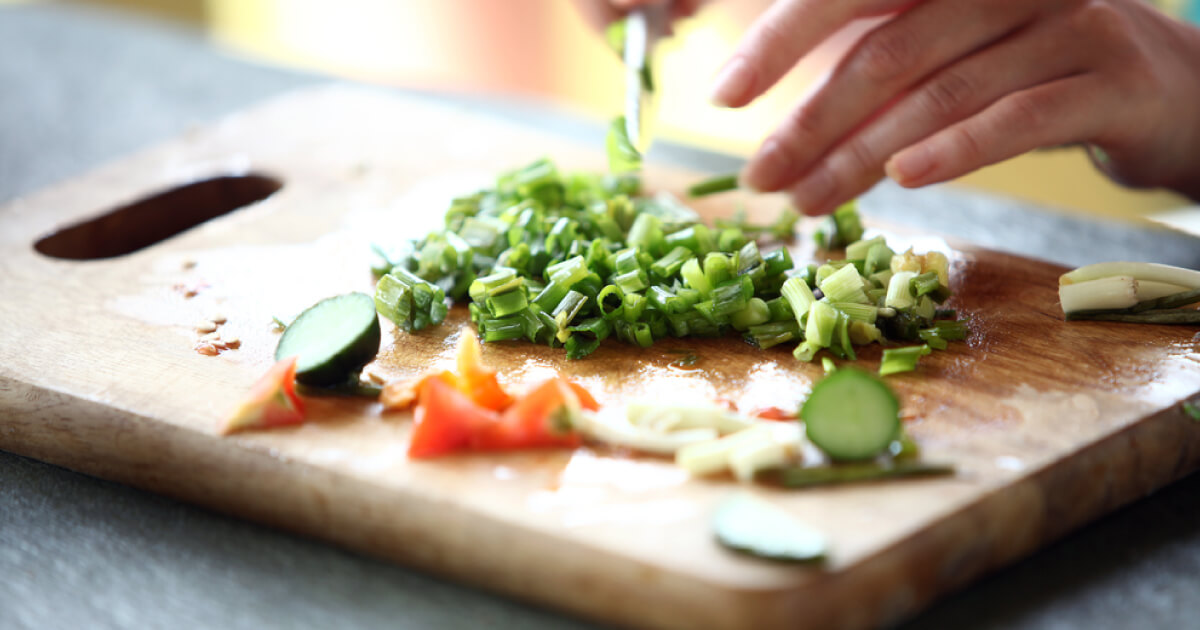 Cutting board with diced veggies