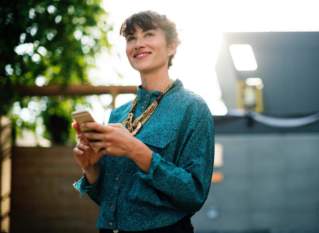 happy woman on her phone